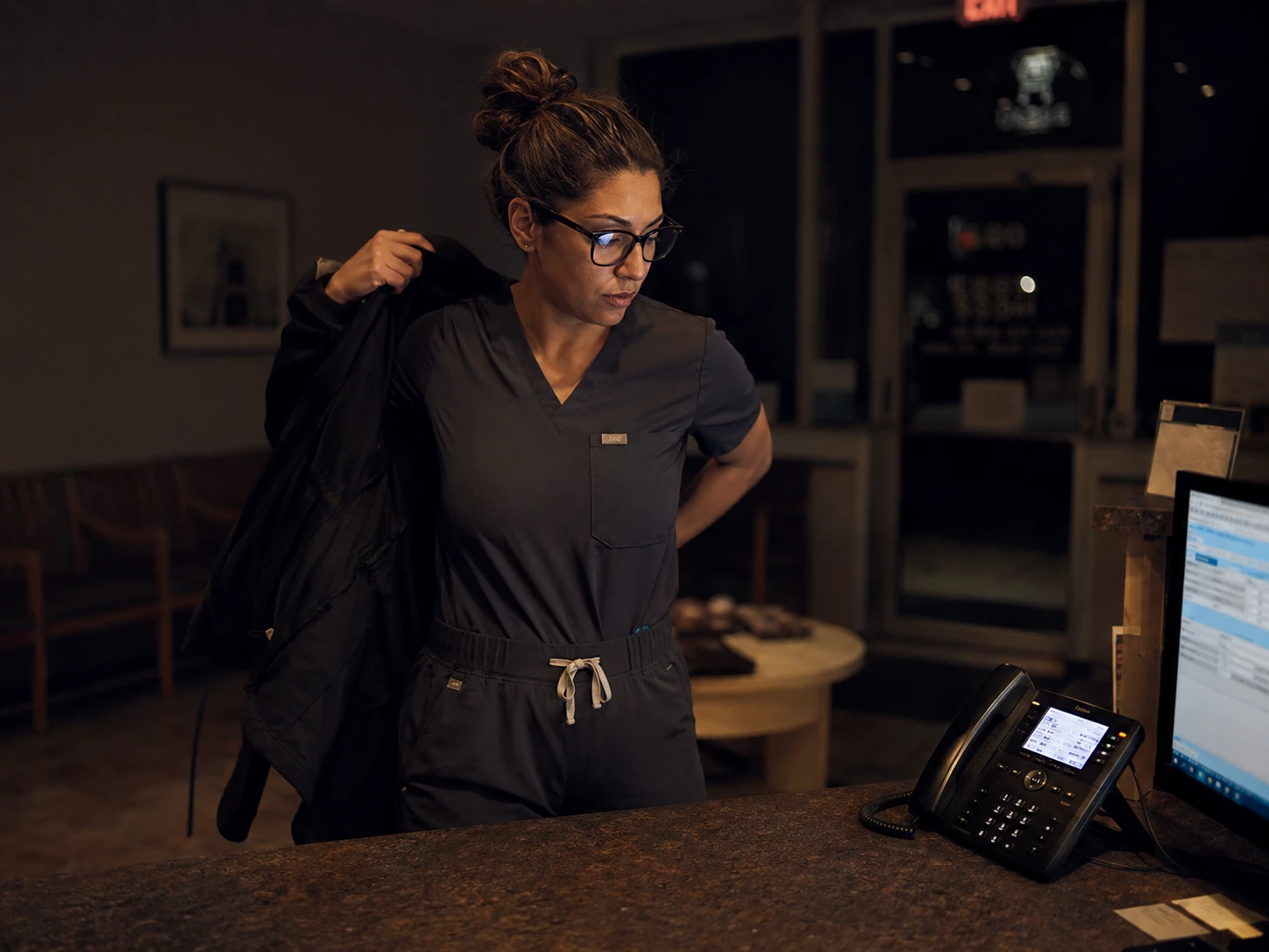 Veterinary technician leaving at night while after-hours phone coverage handles incoming calls