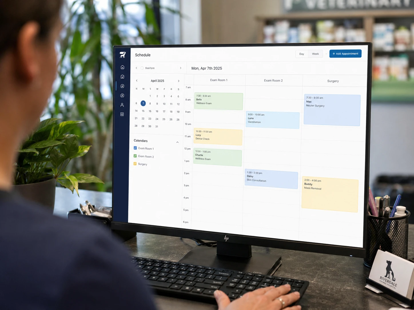 Close-up of an online appointment scheduling calendar on a monitor at a veterinary clinic front desk