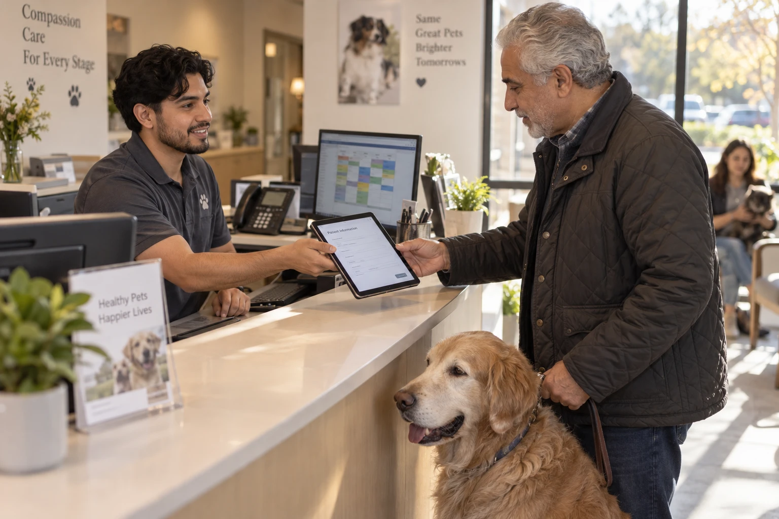 Veterinary receptionist checking in a pet owner using client communication software on a tablet at the front desk